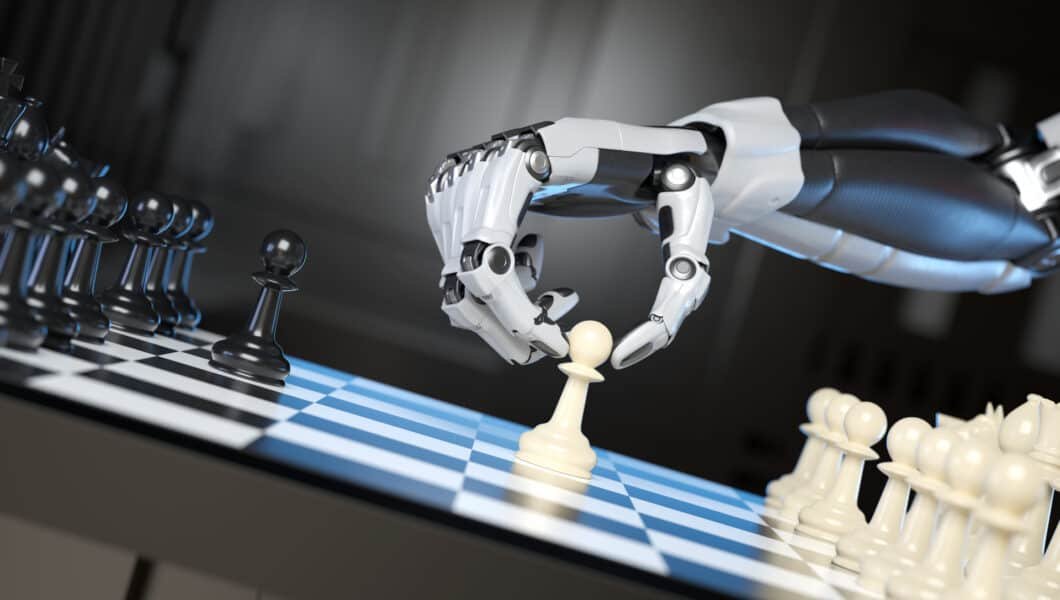 robot's hand moving a pawn