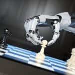 robot's hand moving a pawn