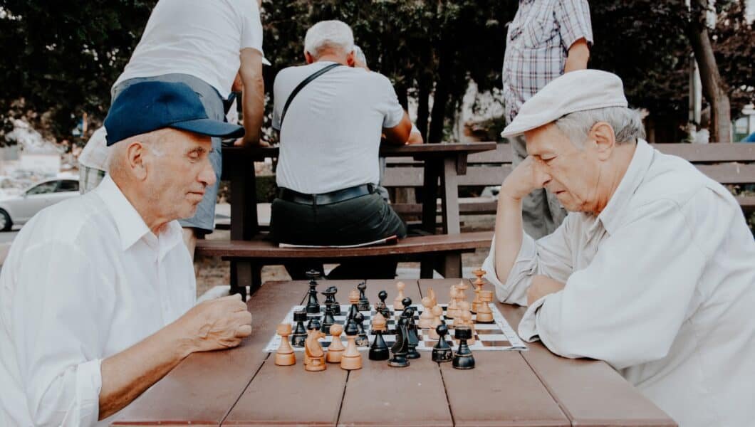 senior citizen playing chess