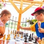 two kids playing chess