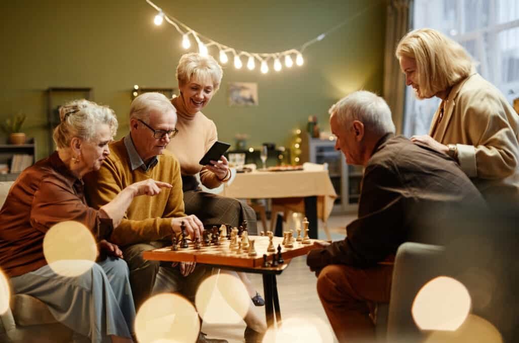 group of senior playing chess