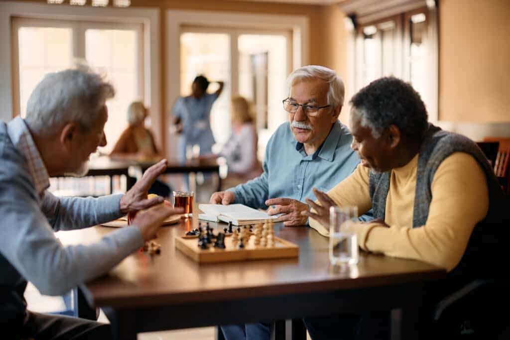 elderly men playing chess