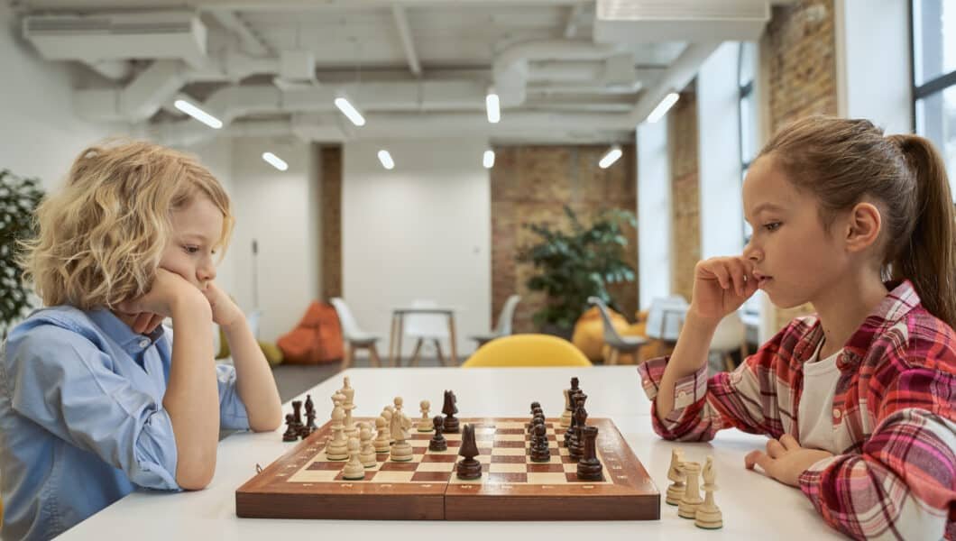 two girls playing ches