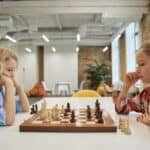 two girls playing ches