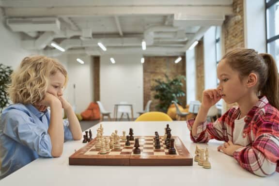 two girls playing ches
