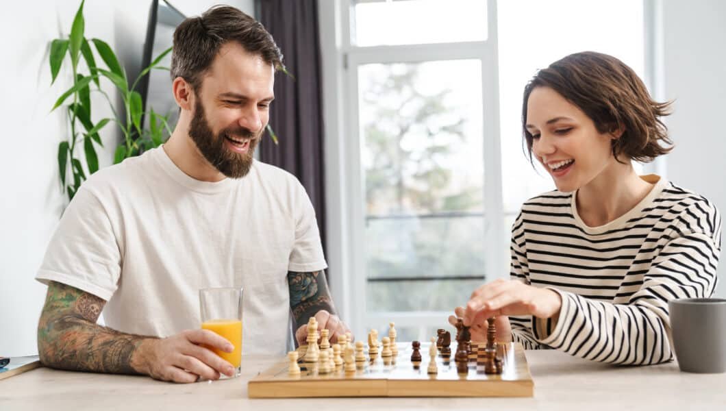 young couple playing chess