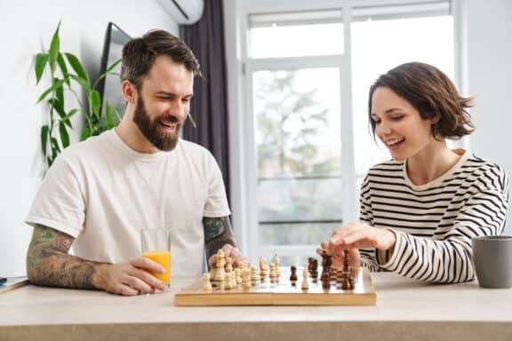 young couple playing chess